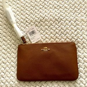 Large Coach wristlet in saddle, NWT